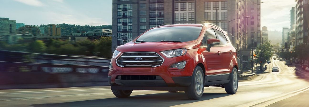2020 Ford Ecosport driving down the highway in a city.