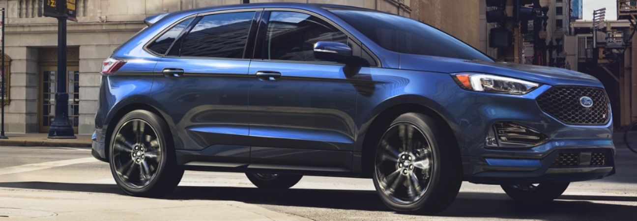Blue 2020 Ford Edge in city